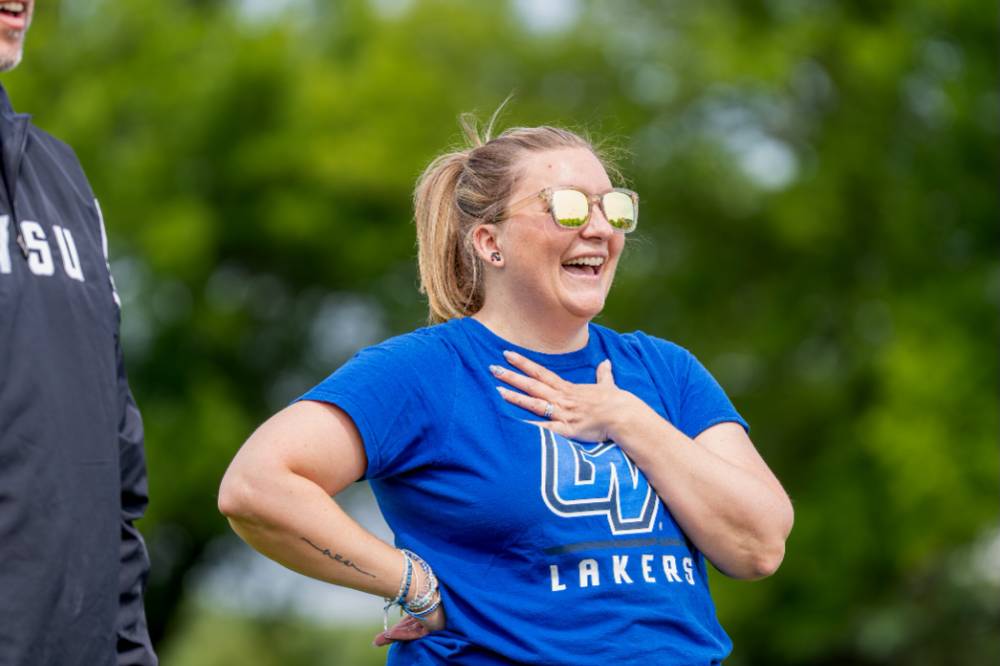 A player smiles wearing sunglasses and a GV Lakers shirt